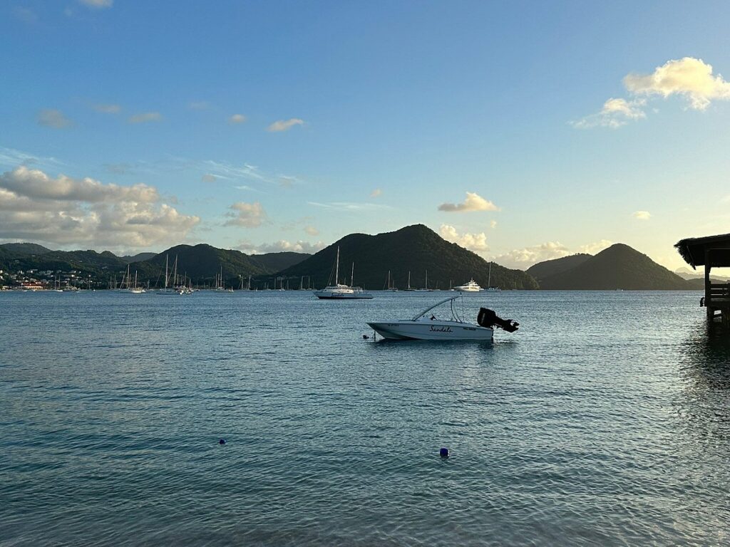 Travelers enjoying snorkeling and catamaran tours in St. Lucia with crystal-clear Caribbean waters and scenic Pitons views.